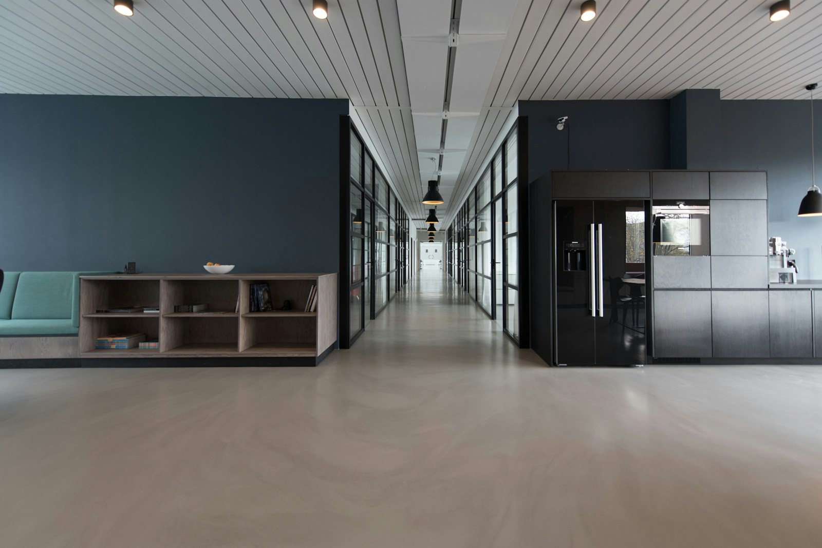 Bright campaign atelier studio with daylight, planning boards, and media flight materials