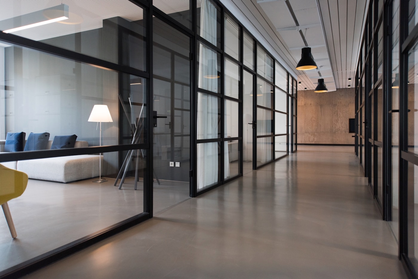 Daylit campaign studio workspace with editorial layout and planning surfaces